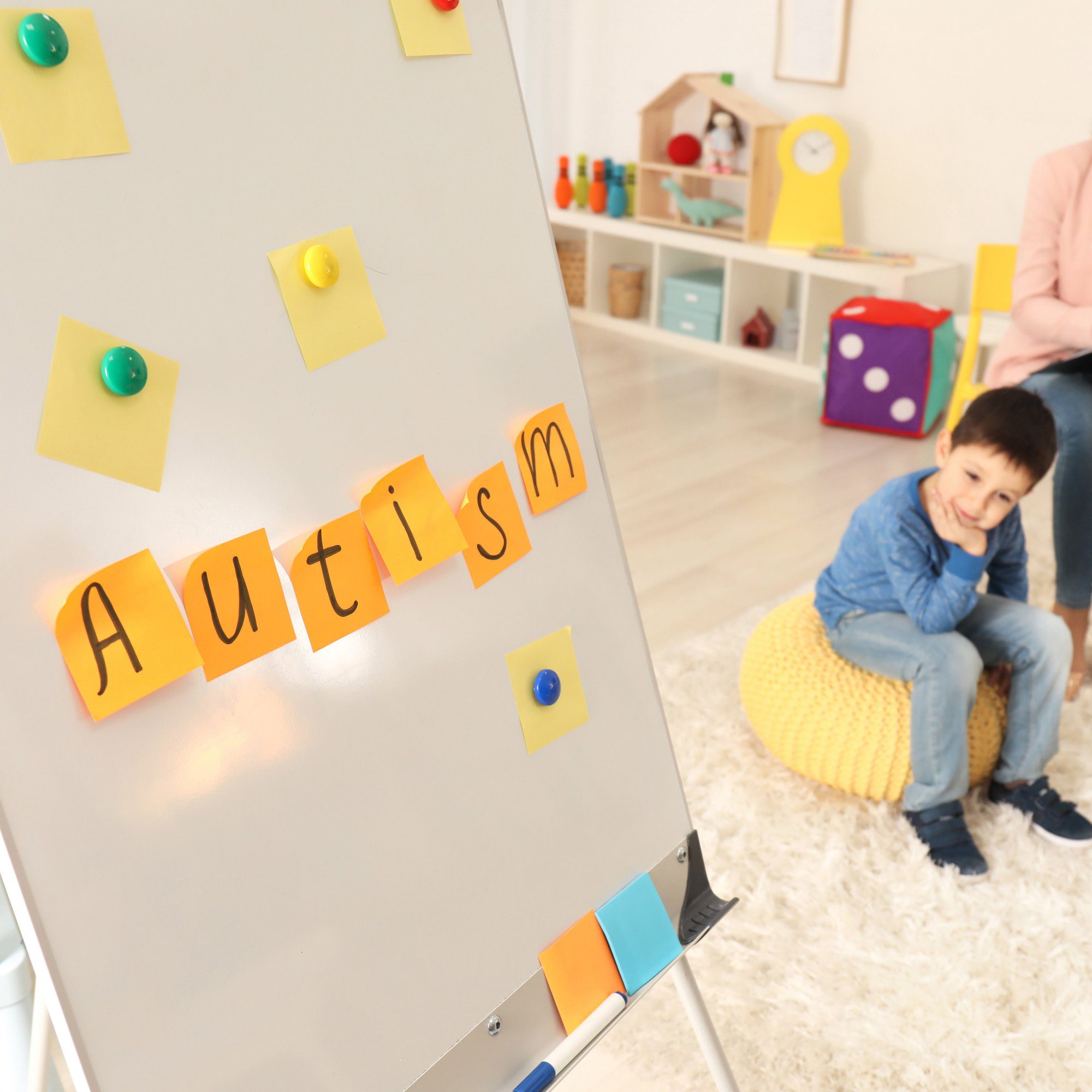 Board with sticky notes at child psychologist's office. Autism concept