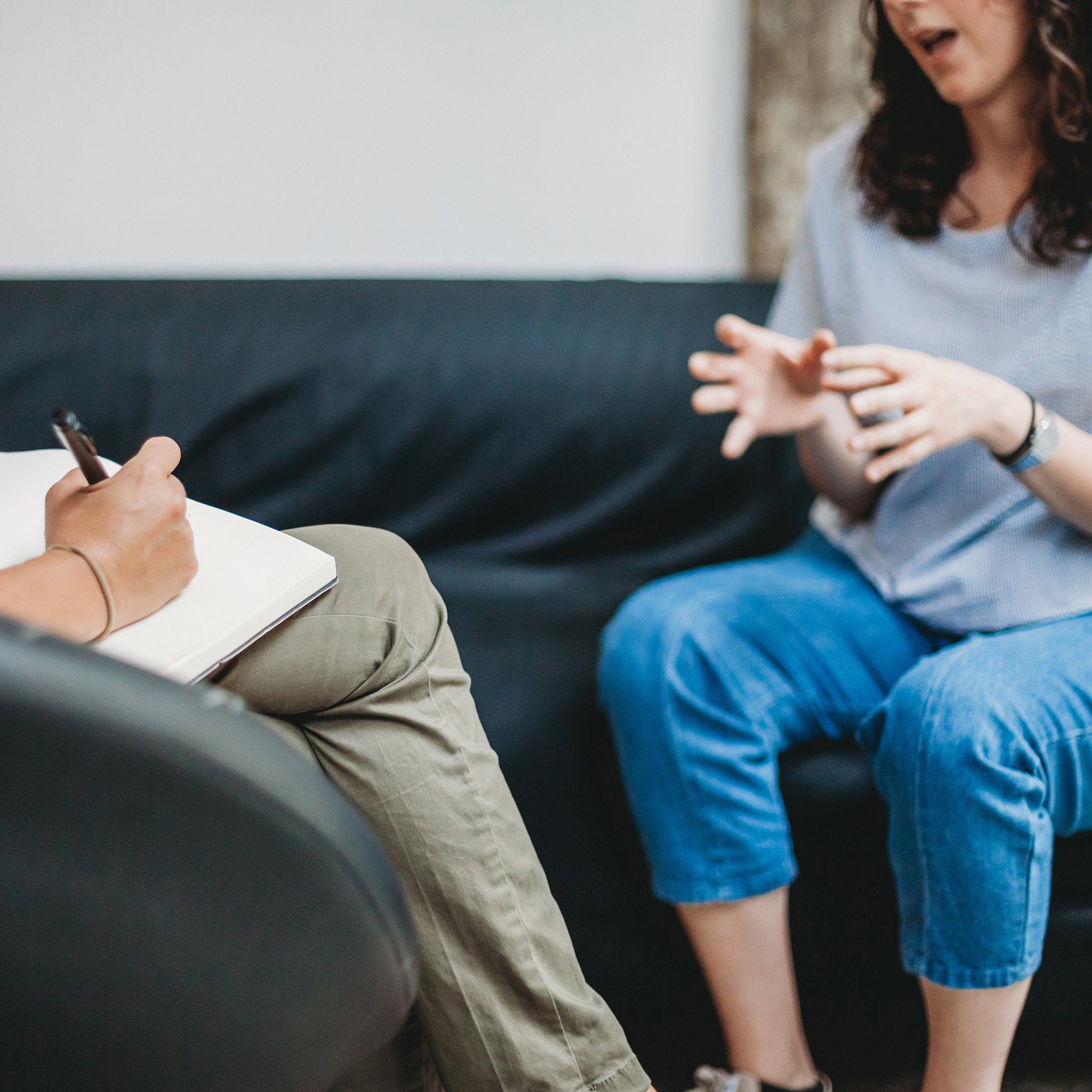 Psychotherapy session, woman talking to his psychologist in the studio